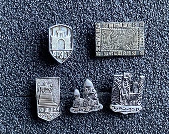 A set of five badges from the USSR era: the cities of Central Asia, Kishinev, Brest, Sivash.