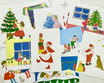 May include: A set of Christmas cards featuring various holiday scenes, including a snowman, a Christmas tree, presents, and children. The cards are decorated with festive colors and illustrations.
