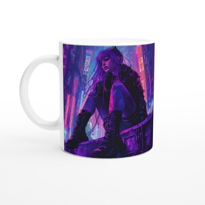 May include: A white ceramic mug with a colorful illustration of a woman in a cyberpunk setting. The woman is wearing a black leather jacket and boots, and her hair is purple. The background is a neon-lit cityscape.