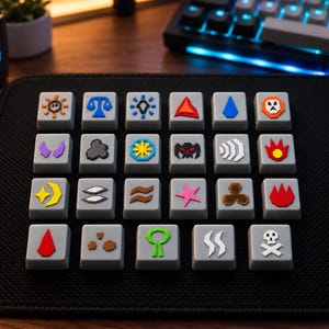 May include: A collection of twenty square grey mechanical keyboard keycaps arranged in a four-by-five grid. Each keycap features a unique, colourful raised icon representing various symbols, including geometric shapes, elemental signs, and a skull and crossbones.