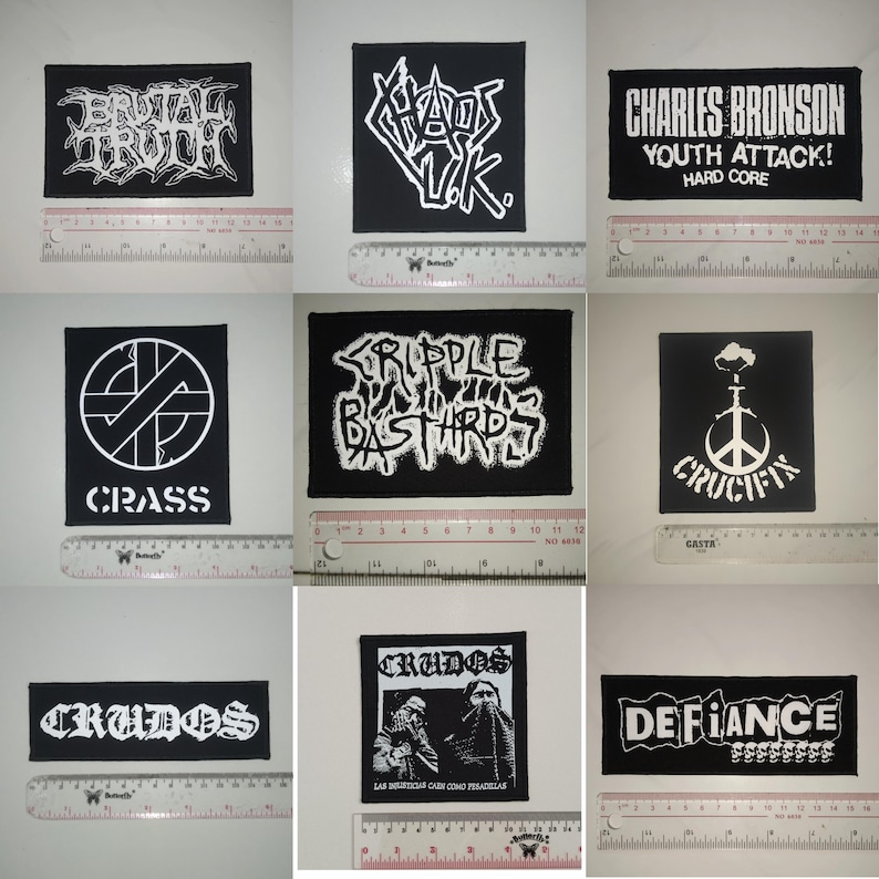 May include: Nine black and white band patches with band names including "Brutal Truth", "Chaos UK", "Charles Bronson", "Crass", "Cripple Bastards", "Crucifix", "Crudos", "Defiance", and "Chaos UK".