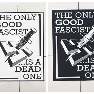 May include: Two images of a poster with the text "THE ONLY GOOD FASCIST...IS A DEAD ONE." The design features a dagger piercing a stylized swastika. One poster is black and white, the other is white and black.