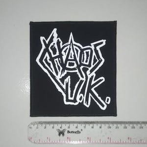 May include: Black fabric patch with white lettering that reads "Chaos UK".