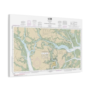 May include: A rectangular nautical chart titled Coosaw and Broad Rivers, featuring detailed hydrographic data, soundings in feet, and navigational markers. The map displays land areas in tan and water in light blue, with black text and grid lines.
