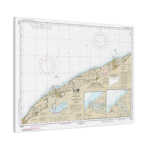 May include: A nautical chart print of the Ashtabula to Chardon River area, featuring detailed coastlines, depth soundings, and navigational markers. The map is printed on a white canvas, with a grid pattern and compass roses.