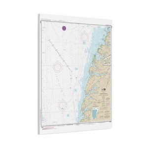 May include: A rectangular nautical chart of the Chesapeake Bay printed on a white canvas. The map features detailed hydrographic data, depth soundings, and navigational markers in shades of blue, tan, and white, with text reading Chesapeake Bay.