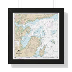 May include: A nautical chart of Salem, Marblehead and Beverly Harbors, Massachusetts. The chart is framed in black and includes detailed information about the waterways, islands, and landmarks in the area.