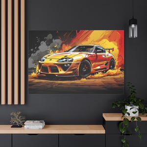 May include: A vibrant canvas print of a yellow and red sports car speeding through flames. The car has a spoiler and black wheels, set against a backdrop of fire and smoke. The artwork is a dynamic illustration.