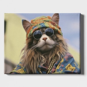 May include: A cat wearing a colorful crocheted hat, round sunglasses, and a patterned shirt with a beaded necklace.