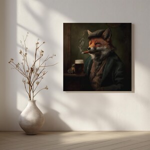 May include: A square canvas print depicts a fox in a tweed cap and jacket, smoking a cigar and holding a beer. The artwork has a vintage, anthropomorphic style, with a dark, moody color palette. A vase with dried branches sits in the foreground.