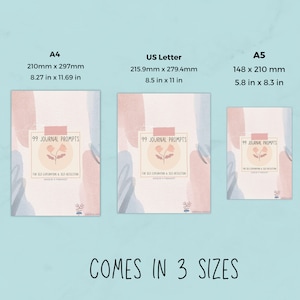 May include: Three different sizes of a journal with 99 journal prompts for self-exploration and self-reflection. The journal cover features a watercolour design with pink and blue colours and a floral illustration. The sizes are A4, US Letter, and A5. The text "COMES IN 3 SIZES" is at the bottom of the image.