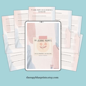 May include: A digital tablet displaying a printable journal with 99 prompts for self-exploration and self-reflection. The journal cover features a pink and blue watercolour design with a flower illustration. The text "99 Journal Prompts" is displayed in a white box with a pink outline.