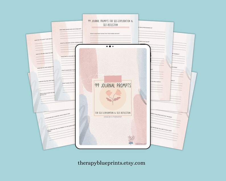 May include: A digital tablet displaying a printable journal with 99 prompts for self-exploration and self-reflection. The journal cover features a pink and blue watercolour design with a flower illustration. The text "99 Journal Prompts" is displayed in a white box with a pink outline.