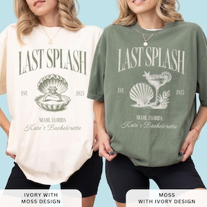 May include: Two t-shirts, one ivory and one moss green, featuring the text "LAST SPLASH" above an illustration of a seashell with a ring and a cocktail. The text "EST. 2025" and "Miami, Florida Kate's Bachelorette" are also printed on the shirts.