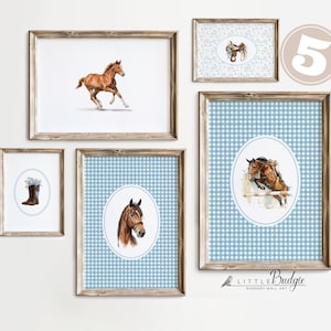 May include: A collection of framed equestrian-themed wall art. The art features watercolor illustrations of horses, a saddle, and a riding boot. The frames are a light brown color, and some backgrounds have a blue gingham pattern.