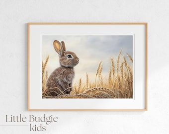 May include: A framed print of a brown rabbit sitting in a field of wheat. The rabbit is looking to the right, and the wheat is a golden color. The background is a light blue sky.
