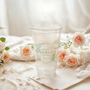 May include: A clear plastic cup with a logo that says "PEONY online France since 1991" surrounded by pink roses.