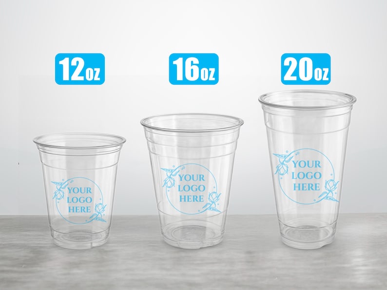 May include: Three clear plastic cups with a blue floral design and the text "YOUR LOGO HERE" printed on them. The cups are 12oz, 16oz, and 20oz.