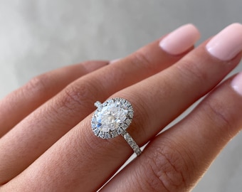Oval Diamond 18K White Gold Halo-Style 1.8Mm Engagement diamond ring.