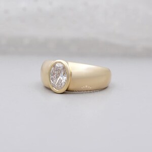 Lab-grown oval diamond ring with sleek bezel design