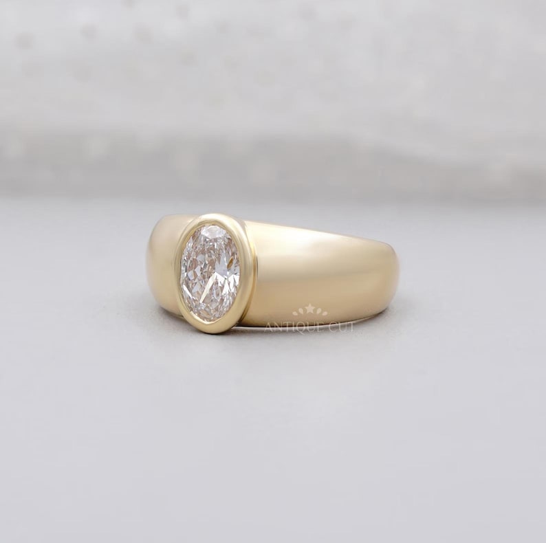 Lab-grown oval diamond ring with sleek bezel design