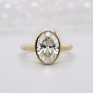 Oval 2.00ct Lab Grown Diamond Bezel Set Engagement Ring in Yellow Gold | IGI Certified