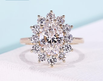 3.12tcw Oval halo engagement ring with floral halo, round prong setting, cathedral design, and 14k yellow gold band