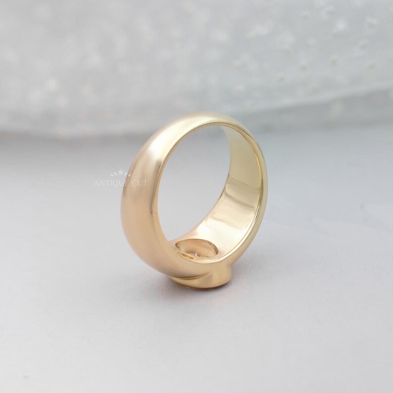 Minimalist oval diamond ring with secure bezel setting