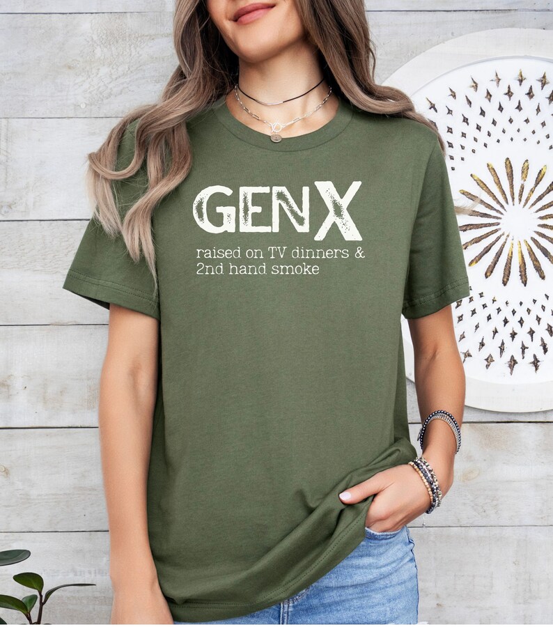 May include: A green t-shirt with the text "GENX raised on TV dinners & 2nd hand smoke" in white.