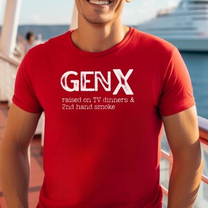 May include: A red t-shirt with white text that reads "GENX raised on TV dinners & 2nd hand smoke".