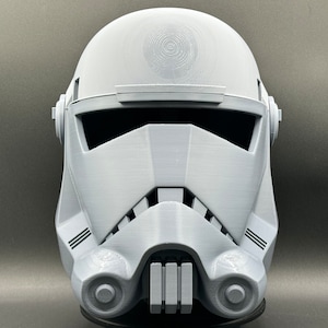 May include: A white plastic helmet with a detailed design, resembling a Star Wars Stormtrooper helmet.