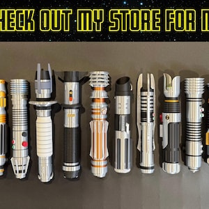 May include: A collection of various lightsabers with silver, black, and gold accents. The image includes the text "BE SURE TO CHECK OUT MY STORE FOR MORE SABERS!" in a yellow font.