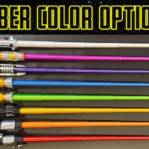 May include: Image shows seven lightsabers with different colored blades: white, pink, purple, blue, green, orange, and red. The hilts are silver and black. The text "SABER COLOR OPTIONS" is at the top in yellow.