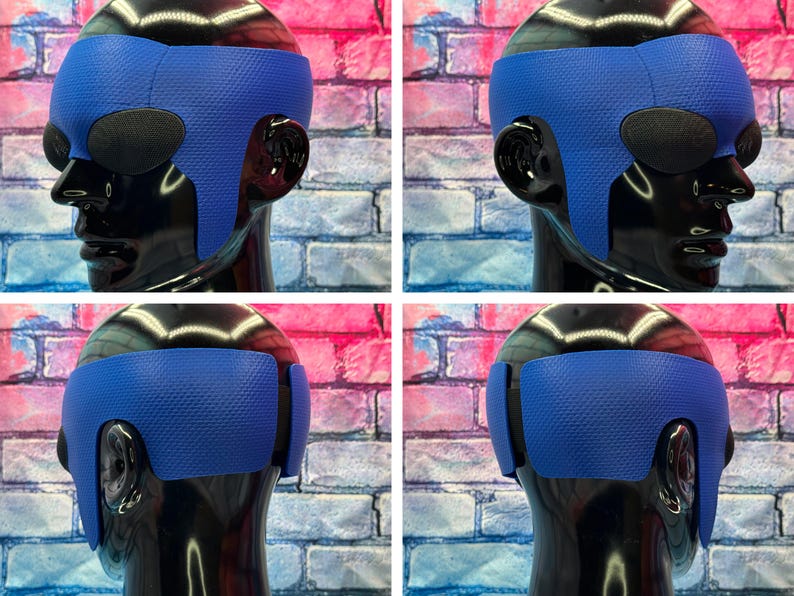 May include: A blue textured head wrap worn on a black mannequin head. The wrap features a honeycomb pattern across the surface, covering the forehead and extending down the sides toward the ears, with dark oval eye coverings visible.