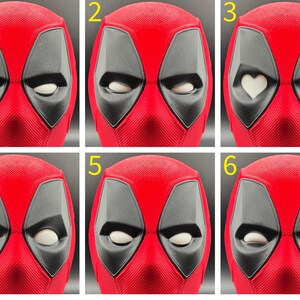 May include: Six different expressions of a red and black Deadpool mask. The mask has a textured surface and black eye holes. The expressions include closed eyes, open eyes, and heart-shaped eyes.