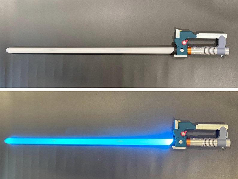 May include: A toy lightsaber with a white blade and a detailed handle in teal, gray, and orange. The second image shows the blade illuminated in bright blue.