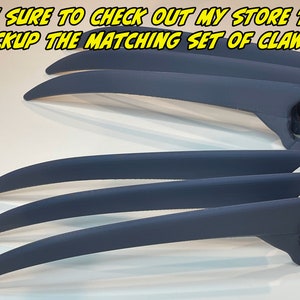 May include: A set of six blue plastic claws, resembling Wolverine's claws, are arranged in a row. The claws are curved and have a sharp point. The text "BE SURE TO CHECK OUT MY STORE TO PICKUP THE MATCHING SET OF CLAWS!" is visible at the top of the image.