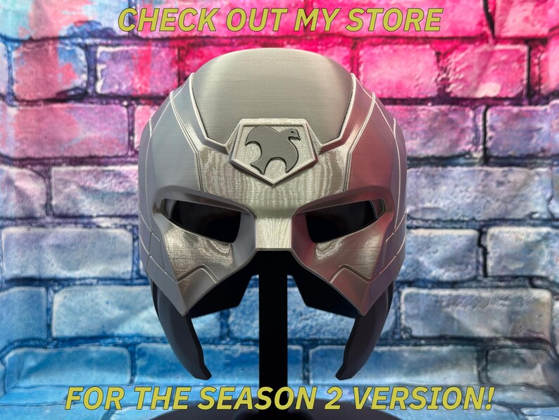 May include: A silver and gray helmet with a stylized bird emblem, displayed against a brick wall. The text "CHECK OUT MY STORE" and "FOR THE SEASON 2 VERSION!" are visible.