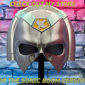 May include: A silver and red helmet with a bird emblem on the front. The helmet has a visor and is displayed on a black stand. Text on the image reads "CHECK OUT MY STORE" and "FOR THE SONIC BOOM VERSION!"