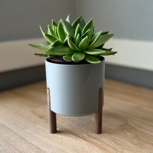 Midcentury modern round planter to fit 3-4" round-pot planted succulents or other plants. Gray, white, black, silver.