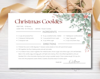 May include: A printable Christmas cookie recipe card with a watercolor illustration of green leaves and red berries. The recipe includes ingredients for 1 dozen cookies and instructions for baking. The card is titled "Christmas Cookies" and includes the prep and cook times.