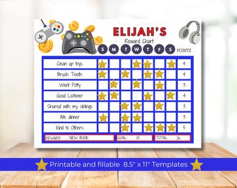 May include: A blue and red printable reward chart for a child named Elijah. The chart has a video game theme with a joystick and controller graphic. The chart has a grid with days of the week and tasks to complete. The tasks include "Clean up toys", "Brush Teeth", "Went Potty", "Good Listener", "Shared with my siblings", "Ate dinner", and "Kind to Others". The chart has a goal of 25 points and a total of 26 points.