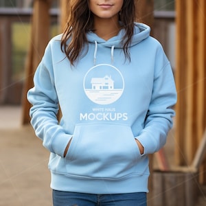 Gildan 18500 light blue hoodie mockup, womens gildan 18500 mockup, gildan 18500 female model, barn, farmhouse