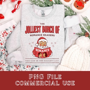 May include: A light gray sweatshirt with the text "THE JOLLEST BUNCH OF ROMANCE READERS." Santa Claus is reading a book that says "ROMANCE." Below the image is the text "THIS SIDE OF THE NAUGHTY LIST."