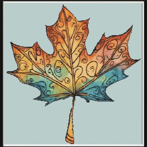 May include: A colorful, stylized maple leaf with intricate swirls and patterns. The leaf is painted in shades of orange, yellow, blue, and green.
