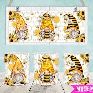 May include: Three white ceramic mugs with a bee and gnome design. The mugs feature a yellow and black bee with a gnome hat and a white beard. The background is a honeycomb pattern with yellow and black bees.