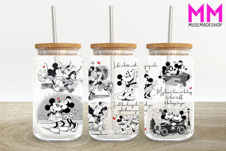 May include: Set of three clear glass tumblers with black and white Mickey Mouse and Minnie Mouse illustrations. Each tumbler has a different design and includes a quote about love. The tumblers have wooden lids and come with clear straws.