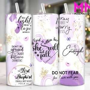 May include: Three stainless steel tumblers with inspirational quotes and bible verses. The tumblers have a white background with purple watercolor designs and gold accents. The quotes are "Be a light to see", "God is within her, she will not fall", and "Pray more worry less".