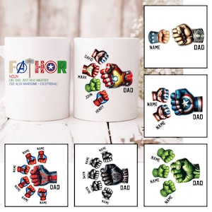 May include: White ceramic mug featuring a design of superhero fists. The mug has the word "FATHOR" written on it, with the text "NOUN LIKE DAD, JUST WAY MIGHTIER /SEE ALSO HANDSOME EXCEPTIONAL/" below it. The mug also has a design of superhero fists with the names "DAVID", "MARK", "JOHN", "HENRY", and "DAD" written on it.