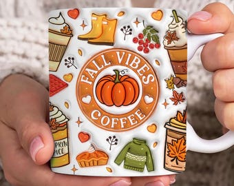 May include: White ceramic mug with a fall-themed design. The mug features a pumpkin, coffee cups, leaves, boots, and the text "Fall Vibes Coffee".
